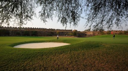 4th green at Hyderabad Golf Club inside Naya Qila with Golconda Fort wall in background